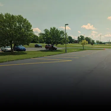 Routine pavement maintenance on a commercial lot